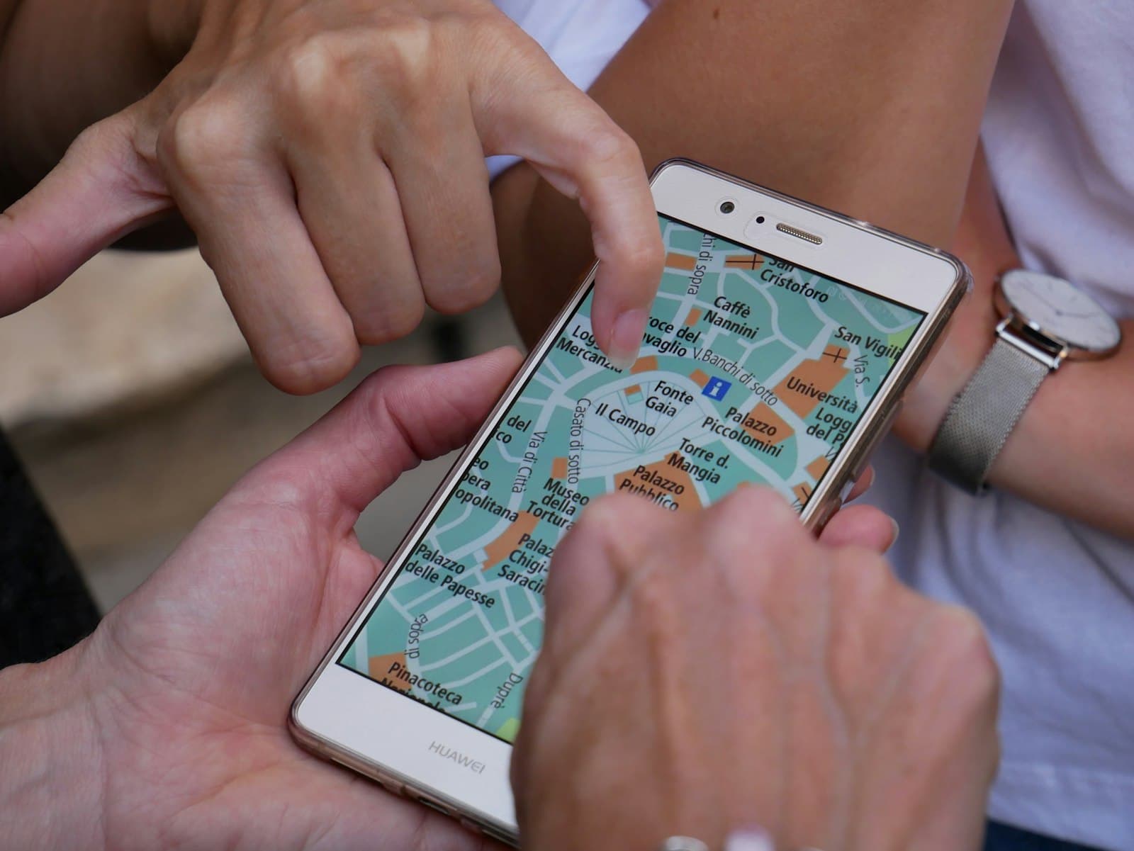 Hand using a map app on a smartphone